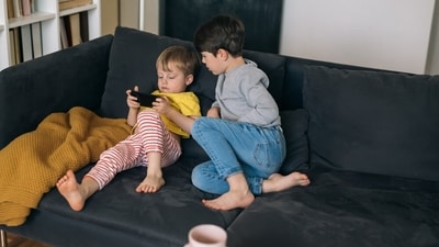 Nowadays, children are in the habit of spending more time playing on phone than going outside and playing. (Shutterstock) Nowadays, children are in the habit of spending more time playing on phone than going outside and playing. (Shutterstock)