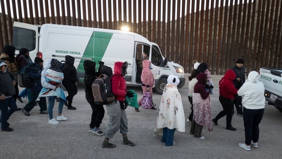 Immigrants prepare to be transported by U.S. Border Patrol agents after crossing the U.S.-Mexico border on January 20, 2025 near Sasabe, Arizona. (Getty Images via AFP)