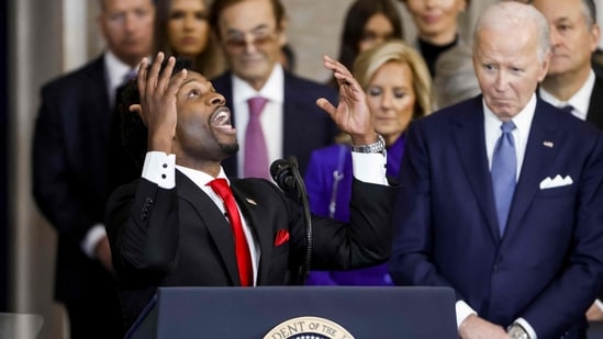 Pastor Lorenzo Sewell (L) of 180 Church in Detroit, Michigan, delivers a benediction as former US President Joe Biden (R) listens during US President Donald Trump�s inauguration as the 47th president of the United States in the rotunda of the United States Capitol in Washington, DC, on 20 January 2025. Trump takes office for his second non-consecutive term as the 47th president of the United States. (Photo by SHAWN THEW / POOL / AFP) (AFP)