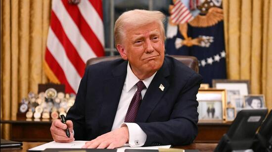 US President Donald Trump signs executive orders in the Oval Office of the White House in Washington, DC, on Monday. (AFP)