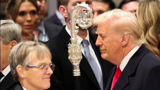 US President Donald Trump stands near Reverend Mariann Edgar Budde as he attends the National Day of Prayer Service at the Washington National Cathedral in Washington, on Tuesday. (REUTERS)