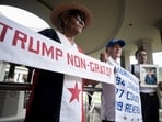 A woman holds up a banner with a message that reads in Spanish; "Trump persona non grata!", during a demonstration marking Martyrs' Day, a national day of mourning to honor the 21 Panamanians who were killed during the January 1964 anti-American riots over sovereignty of the Panama Canal Zone, in Panama City. A woman holds up a banner with a message that reads in Spanish; "Trump persona non grata!", during a demonstration marking Martyrs' Day, a national day of mourning to honor the 21 Panamanians who were killed during the January 1964 anti-American riots over sovereignty of the Panama Canal Zone, in Panama City.
