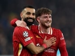 Champions League - Liverpool v Lille - Harvey Elliott celebrates with Mohamed Salah after scoring their second goal