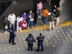 Mexican immigration officials and police receive deportees after they were sent back into Mexico on January 22 as seen from Arizona. U.S. President Donald Trump signed executive orders on his first day in office declaring a state of emergency at the southern border. (Getty Images via AFP)