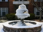 A fountain is seen frozen after a snowfall in Atlanta, Georgia, U.S., January 21, 2025.    REUTERS/Megan Varner