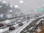 Snow begins to stick on I-285 in Tucker, Ga., as a winter storm brings snow to the South on Tuesday, Jan. 21, 2025.