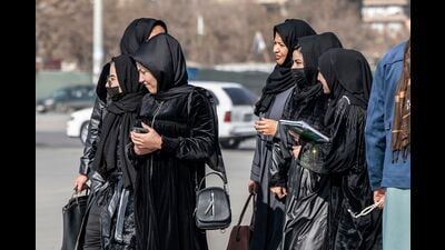 (FILES) Afghan female students studying health studies walk along a street in Kabul on December 3, 2024. (Photo by Wakil KOHSAR / AFP) (AFP) (FILES) Afghan female students studying health studies walk along a street in Kabul on December 3, 2024. (Photo by Wakil KOHSAR / AFP) (AFP)