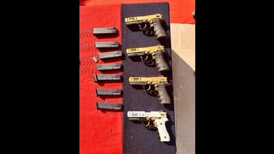Busting two major weapon smuggling cartels, the Punjab Police and the Border Security Force (BSF) on Wednesday recovered 8 pistols and 11 magazines. (HT Photo)