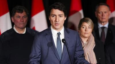 Canadian Prime Minister Justin Trudeau is joined by Minister of Finance Dominic LeBlanc, back left to right, Minister of Foreign Affairs Melanie Joly, Minister of Public Safety David McGuinty, as he holds a press conference during a cabinet retreat at Chateau Montebello in Montebello, on Tuesday. (AP)