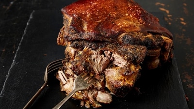 This image released by Milk Street shows a recipe for Puerto Rican slow-cooked pork roast. (AP) This image released by Milk Street shows a recipe for Puerto Rican slow-cooked pork roast. (AP)