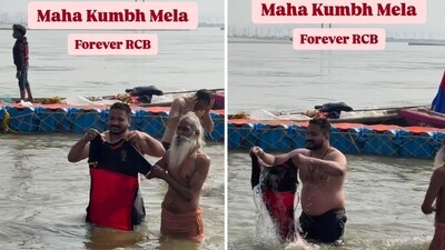 An RCB fan is dipping the team's jersey in Sangam at Mahakumbh. (Instagram/@the_nagendra_gupta)