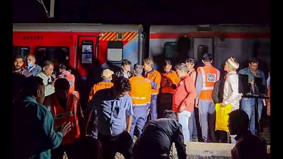 Officials at the site where 12 passengers of Pushpak Express were hit by Karnataka Express, at Pachora in Jalgaon on Wednesday. (ANI) Officials at the site where 12 passengers of Pushpak Express were hit by Karnataka Express, at Pachora in Jalgaon on Wednesday. (ANI)