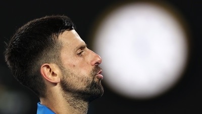 Serbia's Novak Djokovic reacts to a point against Spain's Carlos Alcaraz during their men's singles quarterfinal match on day ten of the Australian Open tennis tournament in Melbourne on January 22 (AFP) Serbia's Novak Djokovic reacts to a point against Spain's Carlos Alcaraz during their men's singles quarterfinal match on day ten of the Australian Open tennis tournament in Melbourne on January 22 (AFP)