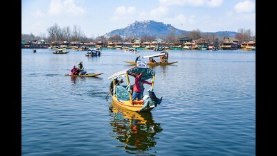 Tourists enjoy a Shikara ride at Dal Lake on a sunny day in Srinagar on Wednesday. (ANI) Tourists enjoy a Shikara ride at Dal Lake on a sunny day in Srinagar on Wednesday. (ANI)