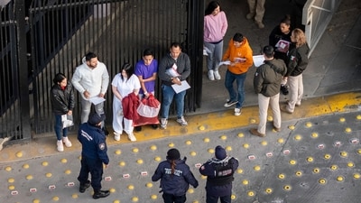Mexican immigration officials and police receive deportees after they were sent back into Mexico on January 22 as seen from Arizona. U.S. President Donald Trump signed executive orders on his first day in office declaring a state of emergency at the southern border. (Getty Images via AFP) Mexican immigration officials and police receive deportees after they were sent back into Mexico on January 22 as seen from Arizona. U.S. President Donald Trump signed executive orders on his first day in office declaring a state of emergency at the southern border. (Getty Images via AFP)