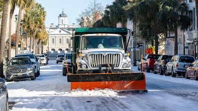 A City of Charleston snowplow clears Broad Street after a winter storm dropped ice and snow Wednesday, Jan. 22, 2025, on Charleston, S.C. (AP) A City of Charleston snowplow clears Broad Street after a winter storm dropped ice and snow Wednesday, Jan. 22, 2025, on Charleston, S.C. (AP)