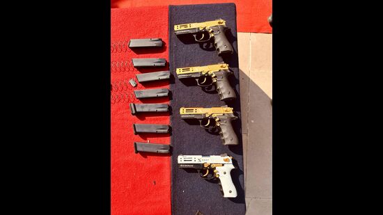 Busting two major weapon smuggling cartels, the Punjab Police and the Border Security Force (BSF) on Wednesday recovered 8 pistols and 11 magazines. (HT Photo)
