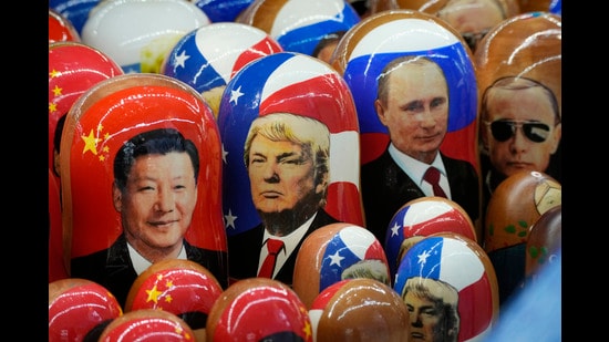 FILE - Traditional Russian wooden dolls called Matryoshka depicting China's President Xi Jinping, U.S. President-elect Donald Trump and Russian President Vladimir Putin are displayed for sale at a souvenir shop in St. Petersburg, Russia on Nov. 21, 2024. (AP Photo/Dmitri Lovetsky, File) (AP)