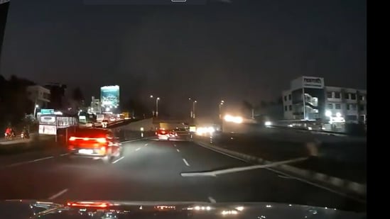 Man placing a wooden log on Bengaluru-Mysuru Expressway. (Screengrab from viral video)
