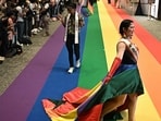 Members of the LGBTQ community walk on a rainbow carpet at a marriage registration event at Paragon shopping mall in Bangkok on January 23, 2025. Almost 2,000 same-sex and transgender couples married in Thailand on January 23 as the kingdom's equal marriage law went into effect in a first for Southeast Asia. (Photo by Lillian SUWANRUMPHA / AFP) Members of the LGBTQ community walk on a rainbow carpet at a marriage registration event at Paragon shopping mall in Bangkok on January 23, 2025. Almost 2,000 same-sex and transgender couples married in Thailand on January 23 as the kingdom's equal marriage law went into effect in a first for Southeast Asia. (Photo by Lillian SUWANRUMPHA / AFP)