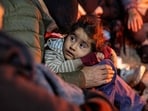 Immigrants from Afghanistan stay warm by a campfire at a transit camp at the US-Mexico border near Sasabe, Arizona. Immigrants from Afghanistan stay warm by a campfire at a transit camp at the US-Mexico border near Sasabe, Arizona.