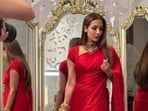 Malaika Arora wore a glossy red saree that is simple yet glam. Malaika Arora wore a glossy red saree that is simple yet glam.