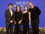 Sachin Tendulkar, Anjali Tendulkar, and Sara Tendulkar with Chris Martin at the 5-year anniversary celebration of The Sachin Tendulkar Foundation.
