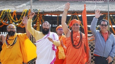 Arunachal Pradesh deputy chief minister Chowna Mein with Swami Adhokshajanand and other saints at Triveni Sangam during the ongoing Mahakumbh 2025, in Prayagraj. (Ravi Prakash/Hindustan Times) Arunachal Pradesh deputy chief minister Chowna Mein with Swami Adhokshajanand and other saints at Triveni Sangam during the ongoing Mahakumbh 2025, in Prayagraj. (Ravi Prakash/Hindustan Times)