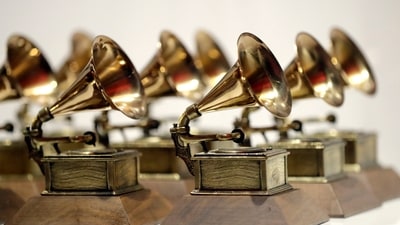 The 67th Grammy Awards are set for February 2, featuring a close race for Album of the Year between Billie Eilish and Beyoncé, both tied. Taylor Swift's film faces snub and other predictions. 
 (AP Photo/Julio Cortez, File) (AP)