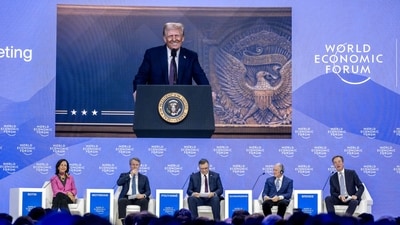 US President Donald Trump is seen on a giant screen during his address by video conference at the World Economic Forum (WEF) annual meeting in Davos on January 23, 2025. (AFP) US President Donald Trump is seen on a giant screen during his address by video conference at the World Economic Forum (WEF) annual meeting in Davos on January 23, 2025. (AFP)