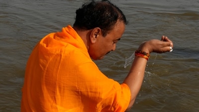 A Hindu devotee prays while taking a holy dip at the Sangam, the confluence of the Ganges, Yamuna, and mythical Saraswati rivers, during the Mahakumbh festival. (AP) A Hindu devotee prays while taking a holy dip at the Sangam, the confluence of the Ganges, Yamuna, and mythical Saraswati rivers, during the Mahakumbh festival. (AP)