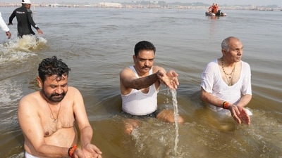 Hindu devotees pray as they take a holy dip at the Sangam, the confluence of three rivers during the Mahakumbh festival. (AP) Hindu devotees pray as they take a holy dip at the Sangam, the confluence of three rivers during the Mahakumbh festival. (AP)