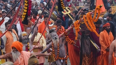 Mahakumbh 2025 live updates: Ash-smeared Naga Sadhus or Hindu holy men (C) of an akhara (monastic Hindu order), walk during a religious procession as they head to take a dip in Sangam, the confluence of Ganges, Yamuna and mythical Saraswati rivers, on the occasion of Maha Kumbh Mela festival, in Prayagraj on January 14. (AFP) Mahakumbh 2025 live updates: Ash-smeared Naga Sadhus or Hindu holy men (C) of an akhara (monastic Hindu order), walk during a religious procession as they head to take a dip in Sangam, the confluence of Ganges, Yamuna and mythical Saraswati rivers, on the occasion of Maha Kumbh Mela festival, in Prayagraj on January 14. (AFP)