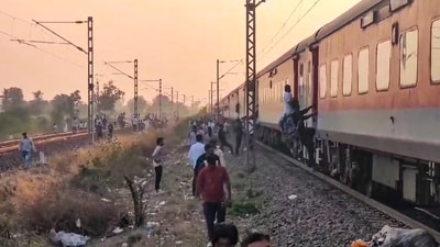 People at the site following the death of several passengers after they stepped down due to a rumour of fire and were run over by another train passing on the adjacent tracks, in North Maharashtra's Jalgaon district, Wednesday. (PTI) People at the site following the death of several passengers after they stepped down due to a rumour of fire and were run over by another train passing on the adjacent tracks, in North Maharashtra's Jalgaon district, Wednesday. (PTI)