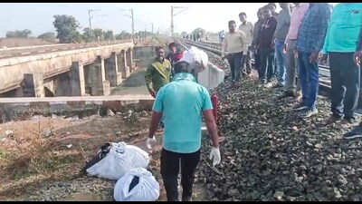 Rescue teams remove belongings a day after a train accident, in Jalgaon district in Maharashtra. (PTI) Rescue teams remove belongings a day after a train accident, in Jalgaon district in Maharashtra. (PTI)