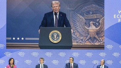 (From L) Santander Bank executive chairperson Ana Botin, Bank of America CEO Brian Thomas Moynihan, French energy group TotalEnergies CEO Patrick Pouyanne, Blackstone CEO Stephen A. Schwarzman World Economic Forum President and CEO Borge Brende attend a session as US President Donald Trump is seen on a giant screen during his address by video conference at the World Economic Forum (WEF) annual meeting in Davos on January 23, 2025. (Photo by Fabrice COFFRINI / AFP) (AFP) (From L) Santander Bank executive chairperson Ana Botin, Bank of America CEO Brian Thomas Moynihan, French energy group TotalEnergies CEO Patrick Pouyanne, Blackstone CEO Stephen A. Schwarzman World Economic Forum President and CEO Borge Brende attend a session as US President Donald Trump is seen on a giant screen during his address by video conference at the World Economic Forum (WEF) annual meeting in Davos on January 23, 2025. (Photo by Fabrice COFFRINI / AFP) (AFP)