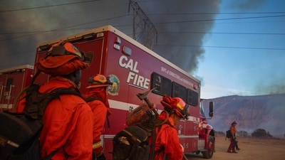 A new 'Hughes Fire' has forced over 50,000 residents of the US state of California to evacuate or be on alert, days after fast-moving wildfires left a path of devastating devastation in the city. In pic: An inmate crew led by firefighters gets ready to fight the fire as smoke from the Hughes Fire fills the sky in Castaic, a northwestern neighborhood of Los Angeles, California (AFP) A new 'Hughes Fire' has forced over 50,000 residents of the US state of California to evacuate or be on alert, days after fast-moving wildfires left a path of devastating devastation in the city. In pic: An inmate crew led by firefighters gets ready to fight the fire as smoke from the Hughes Fire fills the sky in Castaic, a northwestern neighborhood of Los Angeles, California (AFP)