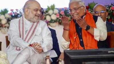 Union home minister Amit Shah with RSS leader Suresh Bhaiyyaji Joshi during the inauguration of 'Hindu Spiritual and Service Fair', in Ahmedabad, on Thursday. (PTI)