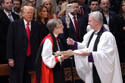 President Donald Trump, from left, watches as Rev. Mariann Budde arrives at the national prayer service at the Washington National Cathedral, Tuesday, Jan. 21, 2025, in Washington. (AP Photo/Evan Vucci) (AP) President Donald Trump, from left, watches as Rev. Mariann Budde arrives at the national prayer service at the Washington National Cathedral, Tuesday, Jan. 21, 2025, in Washington. (AP Photo/Evan Vucci) (AP)