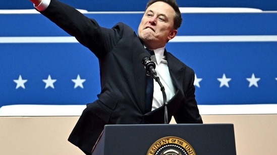 Elon Musk gestures as he speaks during the inaugural parade inside Capitol One Arena, in Washington, DC, on January 20, 2025. Musk's hand gestures at an inauguration event for US President Donald Trump quickly drew comparisons to Nazi salutes. (AFP)