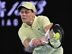 Italy's Jannik Sinner hits a shot against USA's Ben Shelton during their men's singles semi-final 