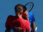 Serbia's Novak Djokovic hugs Germany's Alexander Zverev after retiring from their semi-final match