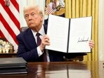 US President Donald Trump holds a signed executive order on AI, in the Oval Office of the White House, in Washington, U.S., January 23, 2025.