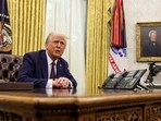 US President Donald Trump sits in the Oval Office of the White House, as he signs executive orders, in Washington, US, January 23, 2025. 