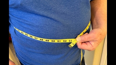 A man uses measuring tape on his waist in California on Jan. 9, 2025. (AP Photo/JoNel Aleccia) (AP) A man uses measuring tape on his waist in California on Jan. 9, 2025. (AP Photo/JoNel Aleccia) (AP)