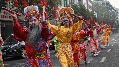 These dancers performed on a street in Shantou, in southern China's Guangdong province on January 23, 2025. The dance form is a mix of martial arts and Chinese opera. ((Photo by JADE GAO / AFP) ) These dancers performed on a street in Shantou, in southern China's Guangdong province on January 23, 2025. The dance form is a mix of martial arts and Chinese opera. ((Photo by JADE GAO / AFP) )