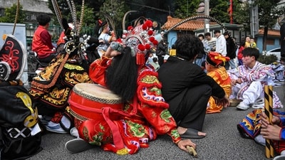 The dancers don costumes and headdresses of mythological characters. This dance form is also a great way to stay connected to the cultural roots, reflecting the cultural heritage. ((Photo by JADE GAO / AFP) ) The dancers don costumes and headdresses of mythological characters. This dance form is also a great way to stay connected to the cultural roots, reflecting the cultural heritage. ((Photo by JADE GAO / AFP) )