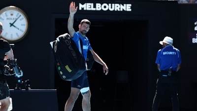 Novak Djokovic acknowledges the applause as he exits the court after retiring from the men's singles semifinal against Alexander Zverev. (AFP) Novak Djokovic acknowledges the applause as he exits the court after retiring from the men's singles semifinal against Alexander Zverev. (AFP)
