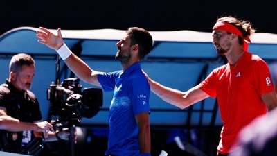 Novak Djokovic shakes hands with the umpire after retiring from his semi final match against Alexander Zverev. (REUTERS)