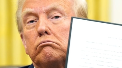US President Donald Trump signs an executive order in the Oval Office of the White House in Washington, DC,. (Bloomberg) US President Donald Trump signs an executive order in the Oval Office of the White House in Washington, DC,. (Bloomberg)